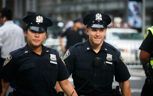 Two police officers in uniform.